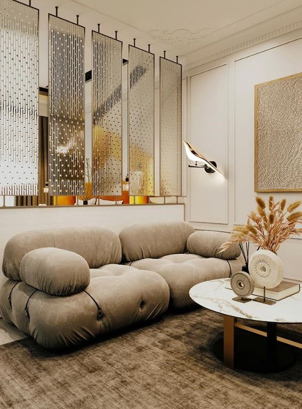 Wypoczynkowy kącik w salonie dekoracyjny kinkiet w kształcie ptaszka Bird i sofa modułowa